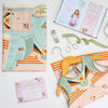 the contents of the dress sewing kit box