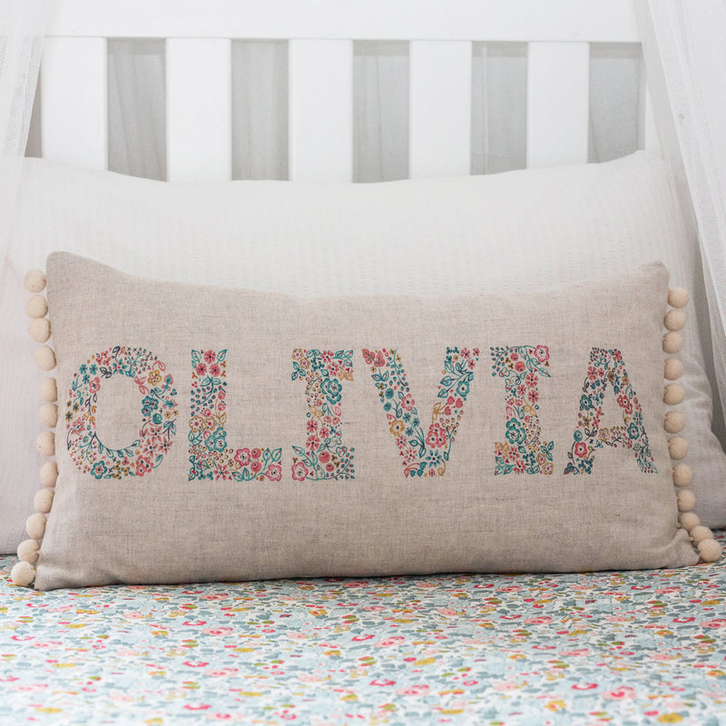 personalised name cushion with hand painted floral letters