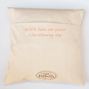 a message on the back of the baby name cushion